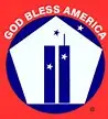 A red badge with the words "God Bless America" in white, featuring a blue pentagon shape with the Twin Towers in the center and stars around them.